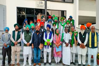 Farmer leader Sarwan Singh Pandher, centre, with protesting farmers ahead of a meeting with the Centre, in Chandigarh, Saturday, Feb. 22, 2025.