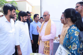 Minister madan Dilawar observing the seed bank exhibition