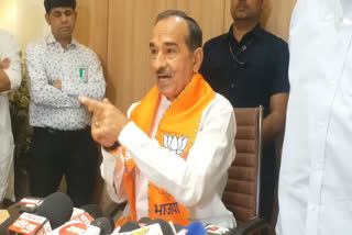 Madan Rathore addressing press conference