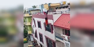 woman falls from roof