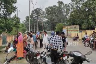 Locals gather outside the house of a man who died by suicide in Korba, Chhattisgarh