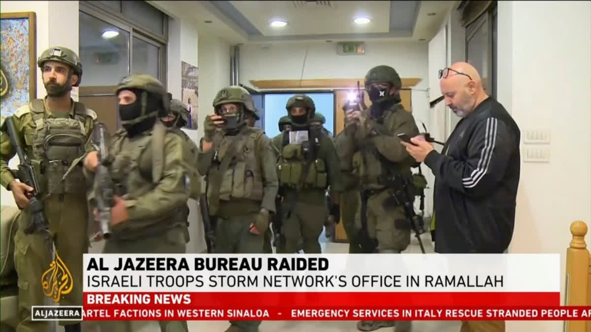 This image made from video provided by Al Jazeera English shows Israeli troops raiding their bureau in Ramallah, West Bank, Sunday, Sept. 22, 2024.