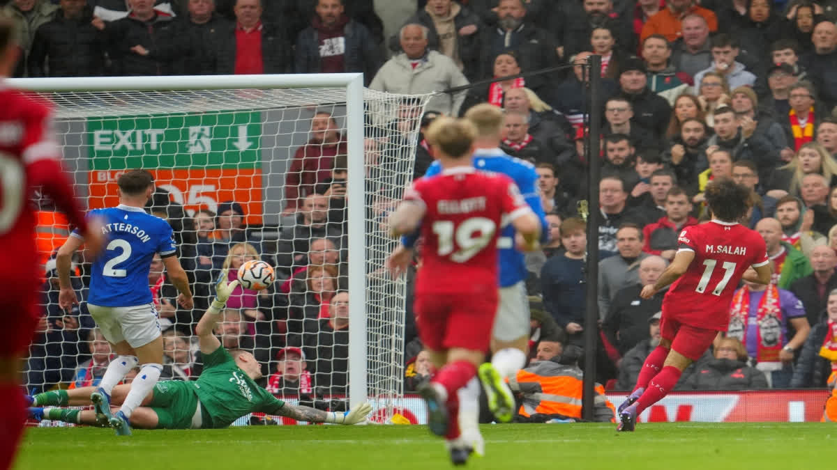 Liverpool striker Mohamed Salah scored two second-half goals to give his side a 2-0 win over Everton in the Merseyside derby and to end 10-man Everton's brave rearguard action.