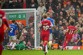 Liverpool striker Mohamed Salah scored two second-half goals to give his side a 2-0 win over Everton in the Merseyside derby and to end 10-man Everton's brave rearguard action.