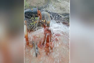 WATER GUSHING FROM THE BOREWELL