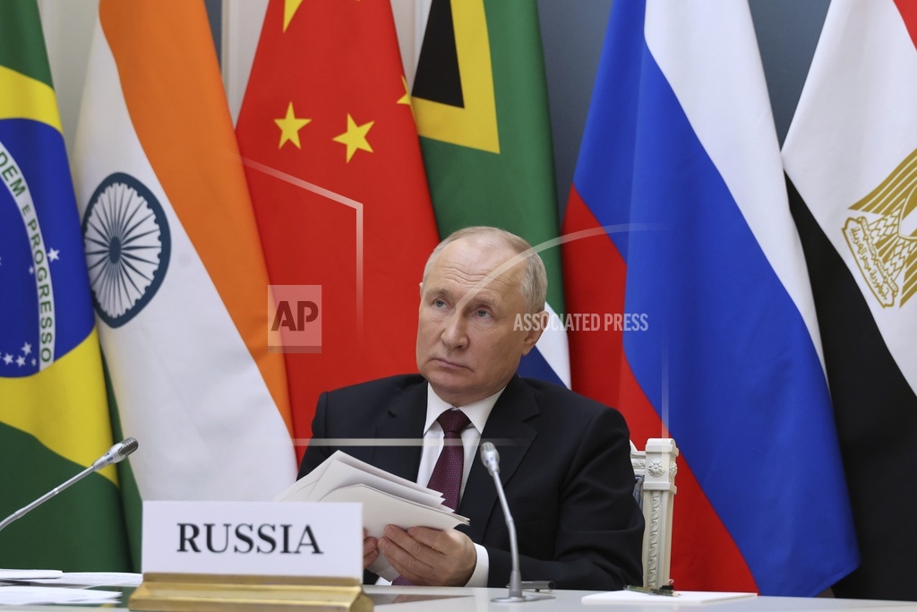 Russian President Vladimir Putin takes part in an extraordinary BRICS summit
