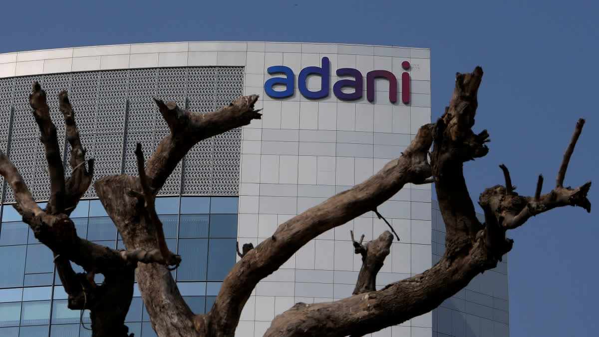 FILE- A tree with dried branches stands outside Adani Corporate House in Ahmedabad, India, Jan. 27, 2023.