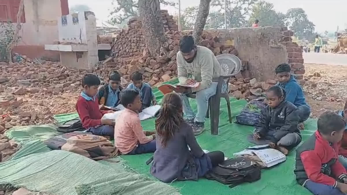 CHILDREN STUDYING UNDER TREES