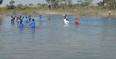 Students Cross River To Reach School