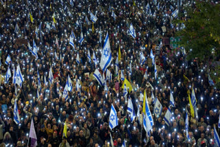 People take part in a protest demanding the immediate release of hostages held by Hamas in the Gaza Strip, in Tel Aviv, Israel, Saturday, March 22, 2025.