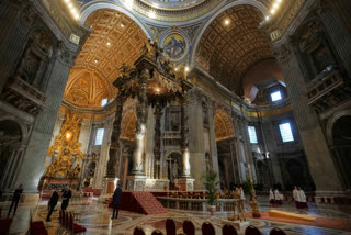 Staff make final preparations in St. Peter's Basilica ahead of the arrival of the body of Pope Francis, who will lie in state for three days, at the Vatican, Wednesday, April 23, 2025.