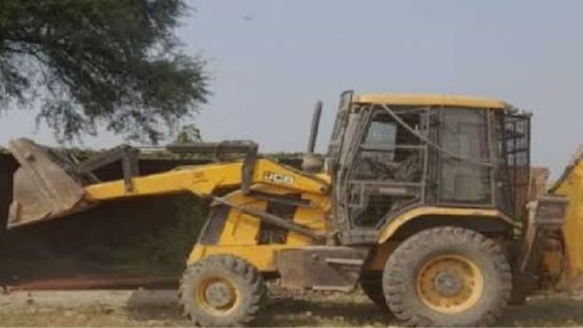 yogi bulldozer removed illegal encroachment from the land in saifai