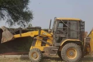 yogi bulldozer removed illegal encroachment from the land in saifai