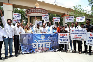 NSUI supporters stage a protest against ongoing NEET UG and NET examination issue, in Nagpur on Friday.