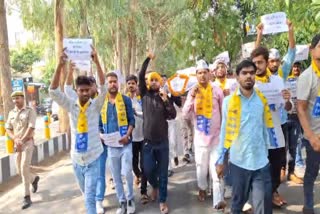 Aam Aadmi Party workers protest in Lucknow over rigging in NEET exam.