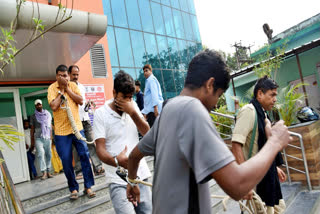 EOU personnel with NEET paper leak accused leave the LNJP Hospital after their medical test, in Patna on Sunday.