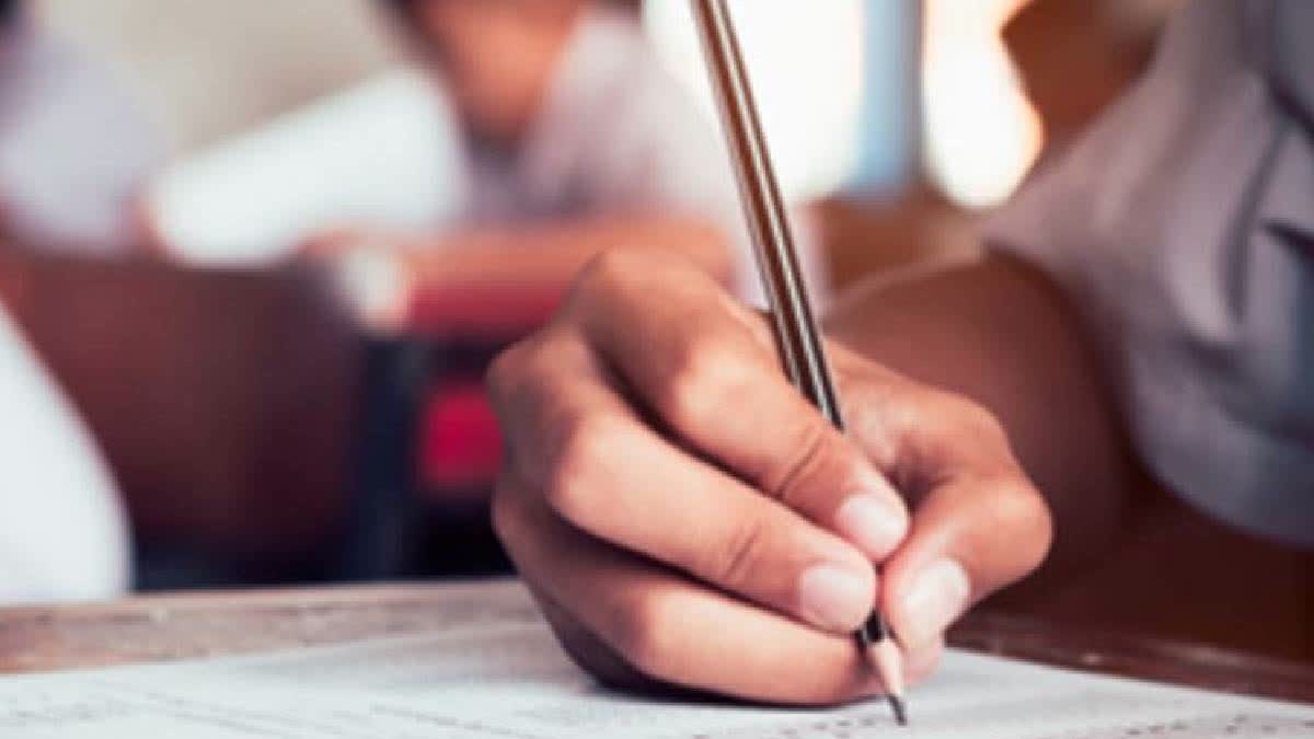 Man tears off wife's answer script during exam