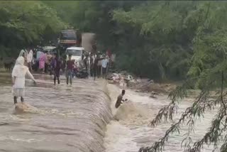 Youth being washed away with Bike