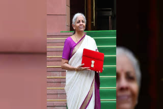 Nirmala Sitharaman captivated attention with her choice of an off-white silk saree adorned with a purple border and golden motifs for the Union Budget 2024 presentation. Her traditional attire complemented by a matching purple blouse and a 'Bahi Khata' styled tabled pouch, highlighted her affinity for cultural symbolism in her wardrobe choices during key governmental events.