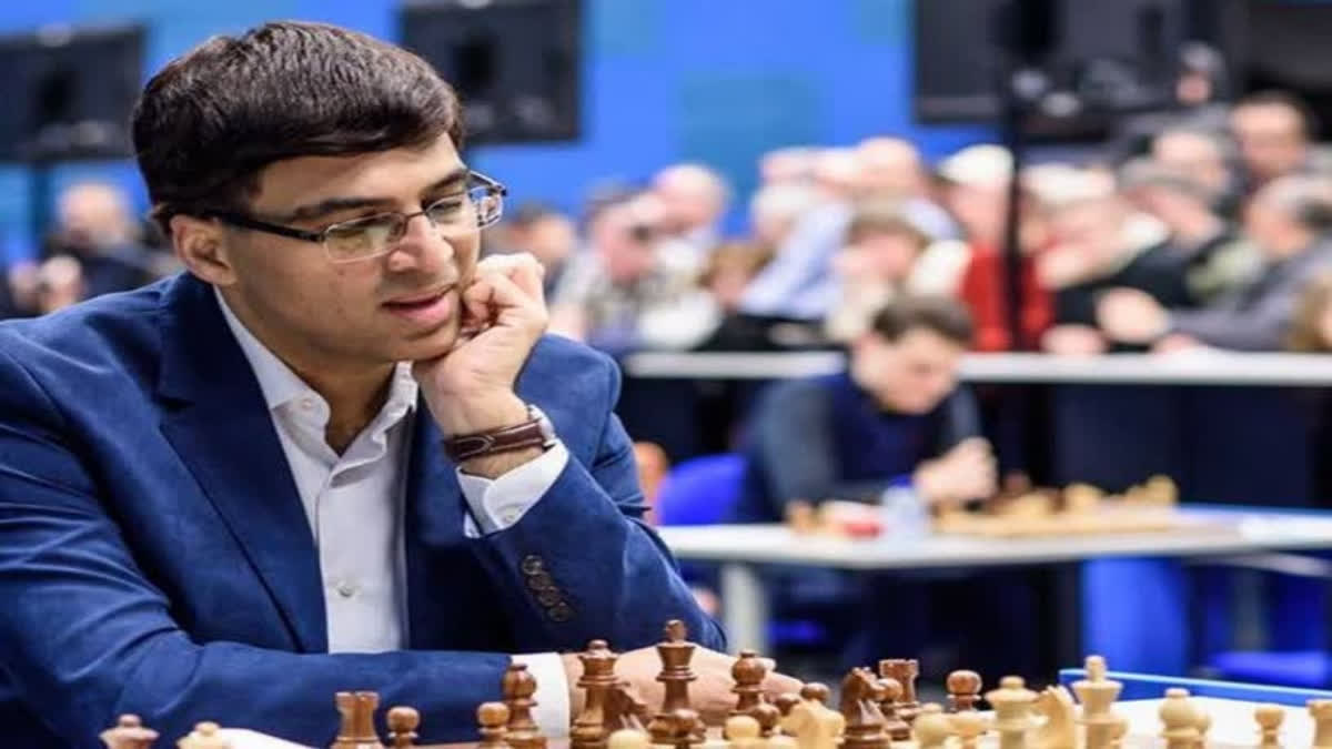 Rameshbabu Praggnanandhaa with Viswanathan Anand. Rameshbabu