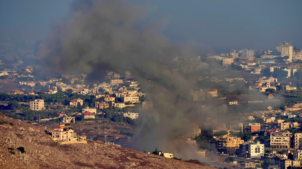 Smoke rises from an Israeli airstrike on Kfar Rouman village, as seen from Marjayoun town, south Lebanon, Monday, Sept. 23, 2024.