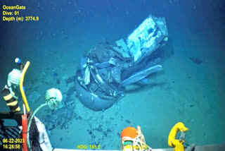 This June 2023 United States Coast Guard still frame from video provided by Pelagic Research Services, shows remains of the Titan submersible, center, on the floor of the Atlantic Ocean.