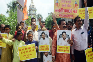 Sanskriti Bachao Manch supporters protest against former Andhra Pradesh Chief Minister YS Jagan Mohan Reddy over the alleged use of 'Animal Fat' in the preparation of laddoos (prasad) of Tirupati Balaji temple, in Bhopal on Sept 20.