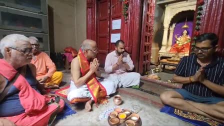 Devotees performing rituals with Panchamrita