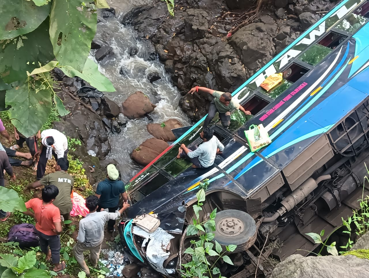 Rescuers evacuate passengers after bus falls into ditch in Maharashtra's Amravati on Monday September 23, 2024