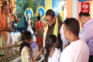 ranoj pegu offers prayer at Durga Puja