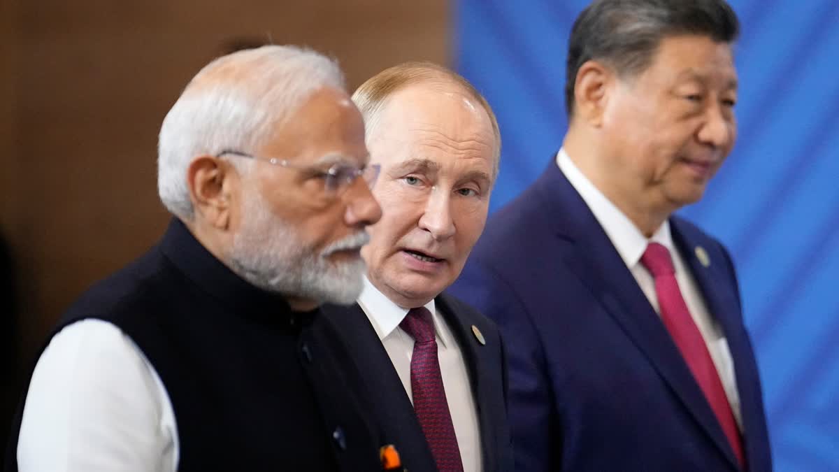 From left, Indian Prime Minister Narendra Modi, Russian President Vladimir Putin and Chinese President Xi Jinping attend a family photo ceremony prior to the BRICS Summit plenary session in Kazan, Russia, Wednesday, Oct. 23, 2024.