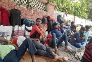 Migrant workers wait for their trains at Jammu railway stations after leaving Kashmir After Ganderbal Militant Attack