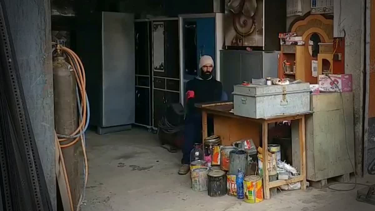 An industrial unit owner sits at his unit in south Kashmir. In Winter, Unscheduled Power Cuts Impact Industrial Units In Kashmir