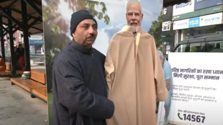 KASHMIRI MAN EXPRESSES HIS FERVENT ADORATION FOR PM MODI DRAPES LEADERS CUT OUT IN PHERAN