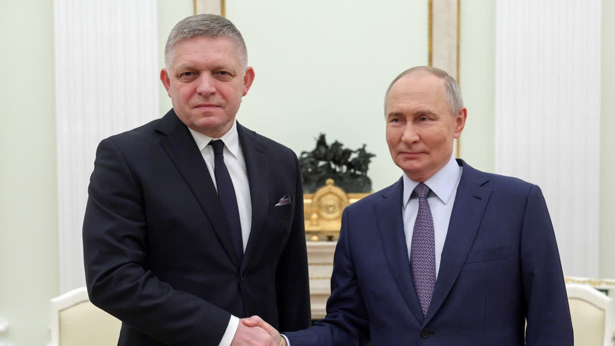 Russian President Vladimir Putin, right, and Slovak Prime Minister Robert Fico shake hands during their meeting at the Kremlin in Moscow, Russia, Sunday, Dec. 22, 2024.