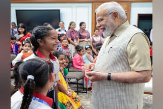 Prime Minister Narendra Modi in coversation with children on the occasion of National Girl Child day