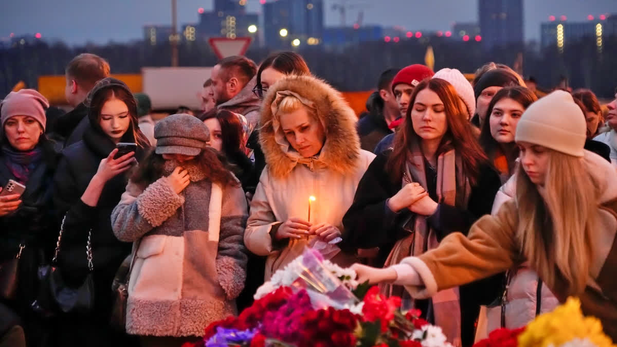 Family and friends of those still missing after an attack that killed over 130 people at a suburban Moscow concert hall waited for news of their loved ones as Russia observed a day of national mourning on Sunday.