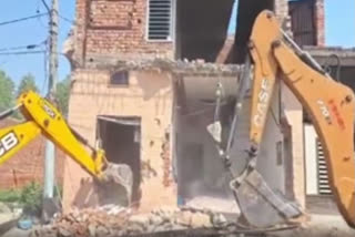 Drug peddler's house being demolished in Ludhiana.