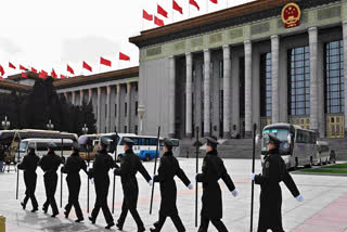 Chinese People's Liberation Army (PLA) soldiers are seen outside the Great Hall of the People in Beijing