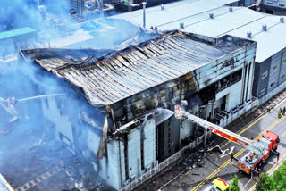 Firefighters work at the site of a burnt lithium battery manufacturing factory in Hwaseong, South Korea, Monday, June 24, 2024.