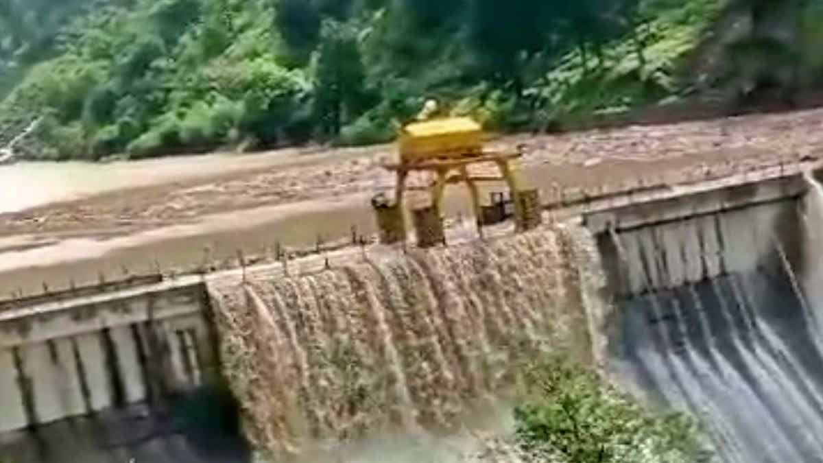 water flowing over malana dam