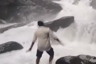 A young man was washed away by the heavy flowing water at Arashinagundi Falls near Kollur in the Udupi district of Karnataka on Sunday evening, July 23