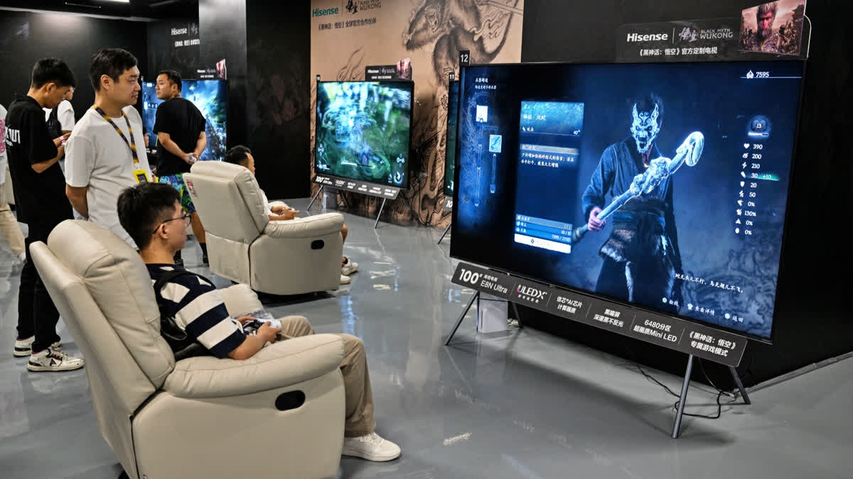 A young man plays Chinese action role-playing game 'Black Myth: Wukong', developed by Chinese video game company Game Science, during its launch day in Shanghai on August 20, 2024.