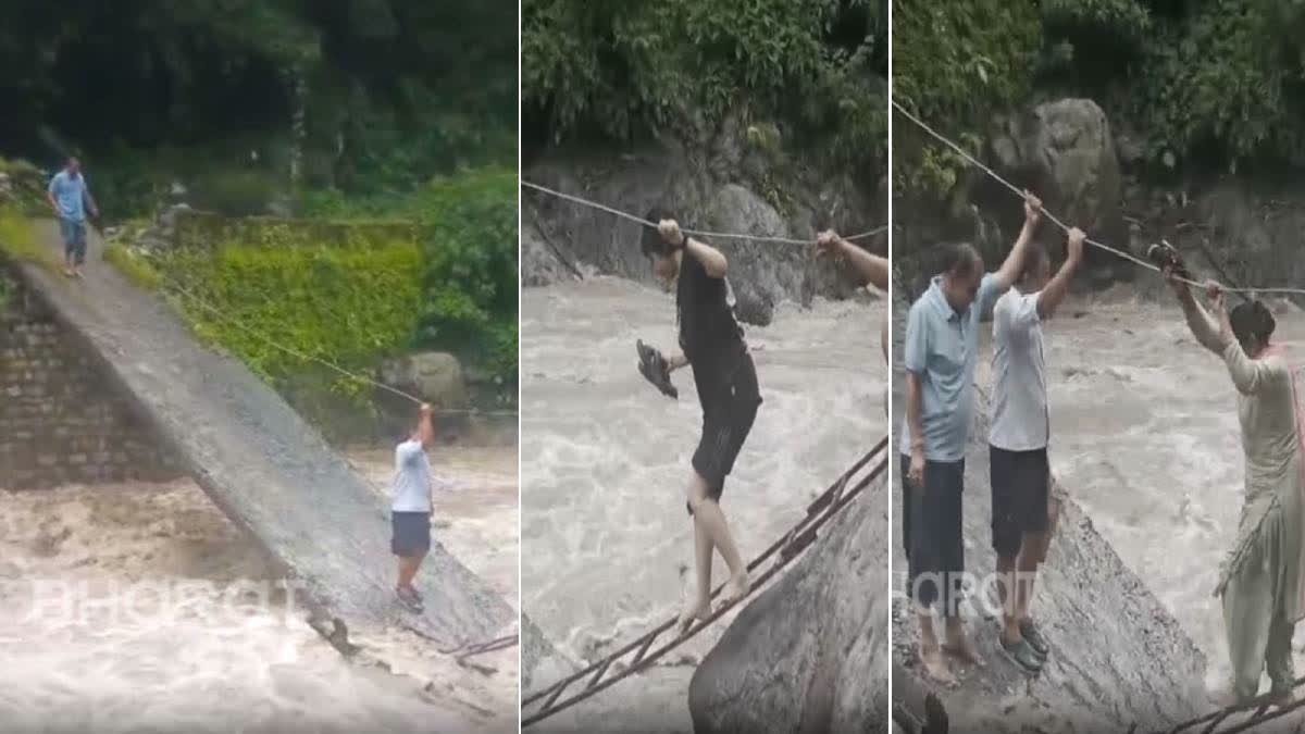 Villagers in Uttarakhand struggle to cross a bridge in Doiwala that was partially washed away last year