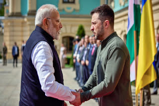 Prime Minister Narendra Modi exchanges greetings with Ukrainian President Volodymyr Zelenskyy on his arrival at Mariinsky Palace, in Kyiv on Friday.