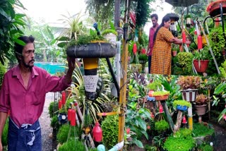Amballur native Chandran gardening in Waste Things  Gardening With Waste Things  gardening in Waste Things  പാഴ്‌വസ്‌തുക്കളില്‍ ചെടികള്‍  ആമ്പല്ലൂരിലെ ചന്ദ്രന്‍റെ വേറിട്ട പൂന്തോട്ടം  പ്ലാസ്റ്റിക് പാത്രങ്ങള്‍  ടർട്ടിൽ വൈൻ