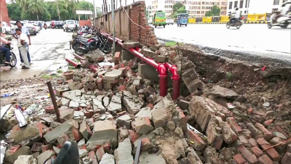 A compound wall in Thane collapsed early Tuesday morning, damaging at least 20 parked two-wheelers but causing no injuries. The collapse occurred after the city experienced heavy rains. Local disaster management teams responded promptly to remove debris and ensure safety.