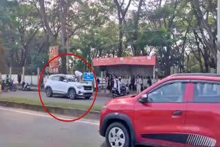 A shocking incident took place in Shivamogga when a car dragged a traffic police officer on its bonnet after the man attempted to evade a routine vehicle check.