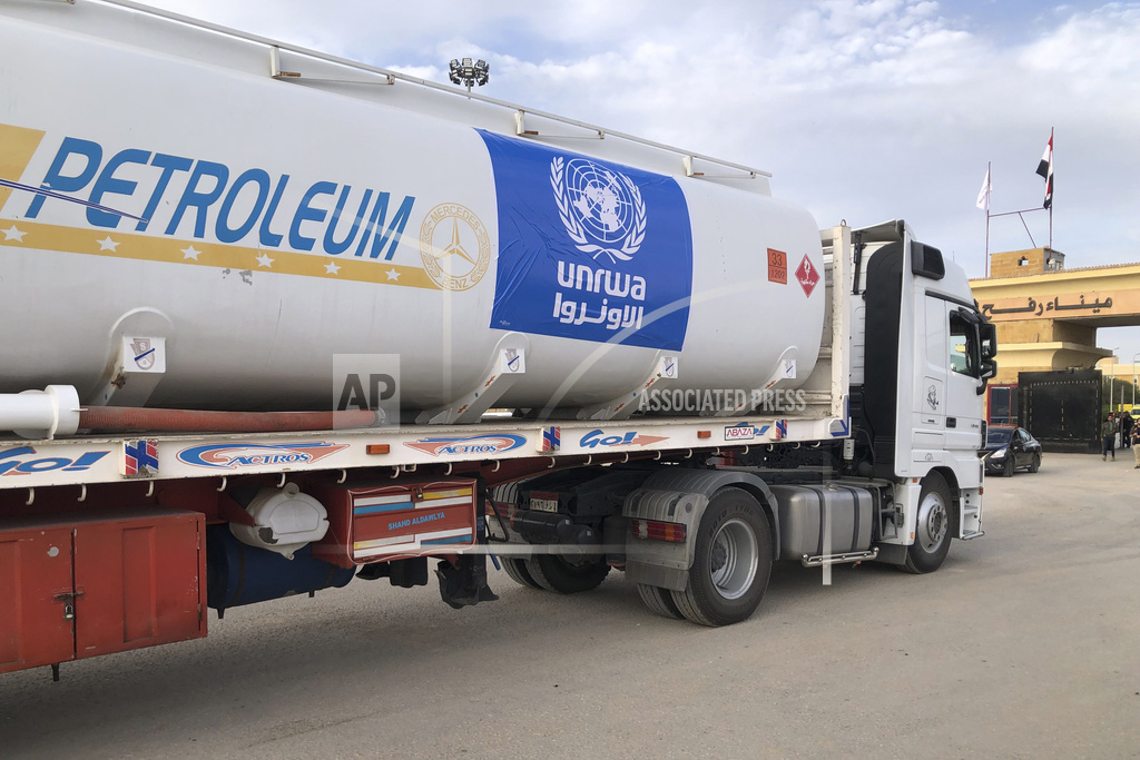 Trucks carying humanitarian aid line up in Rafah, Egypt