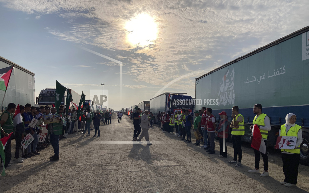 Trucks carying humanitarian aid line up in Rafah, Egypt